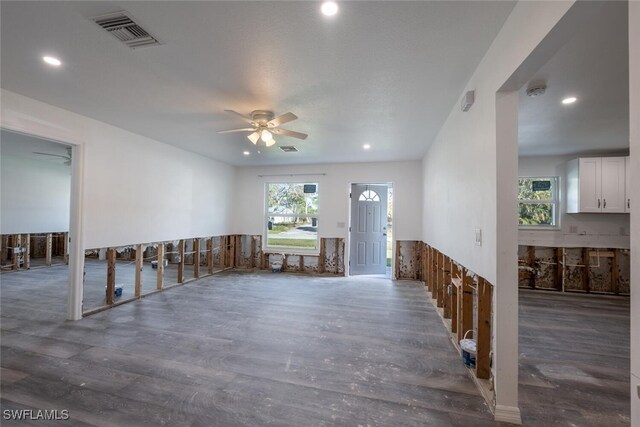 empty room featuring ceiling fan and dark hardwood / wood-style flooring