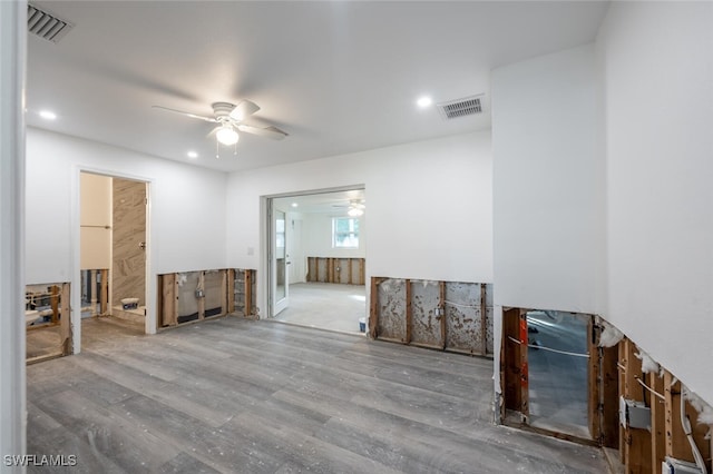 empty room featuring hardwood / wood-style flooring and ceiling fan