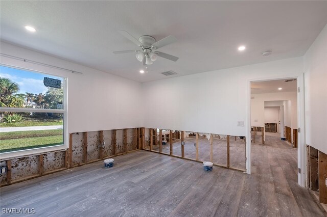 spare room with hardwood / wood-style floors and ceiling fan