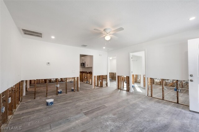 unfurnished room with wood-type flooring and ceiling fan