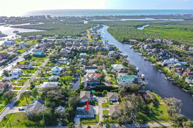 drone / aerial view with a water view