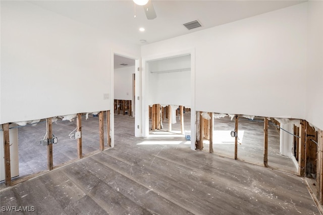 empty room featuring dark hardwood / wood-style flooring and ceiling fan