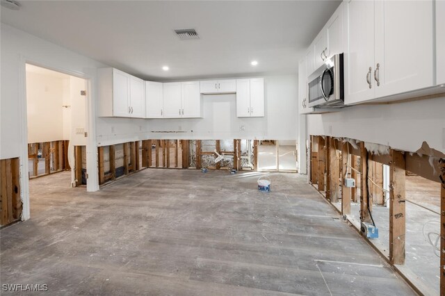 kitchen featuring white cabinets