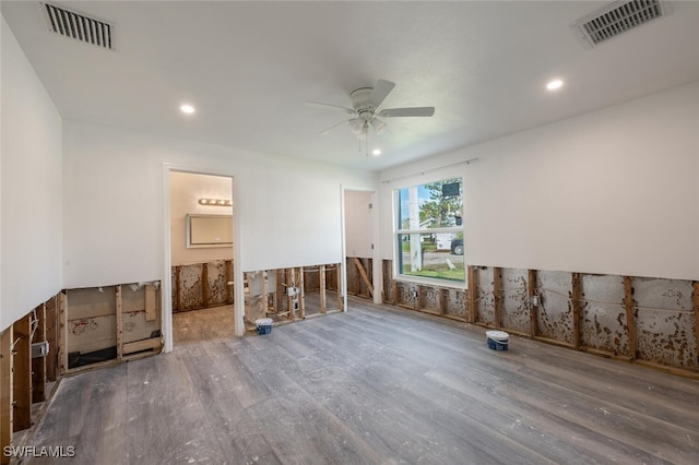 unfurnished room with hardwood / wood-style floors and ceiling fan