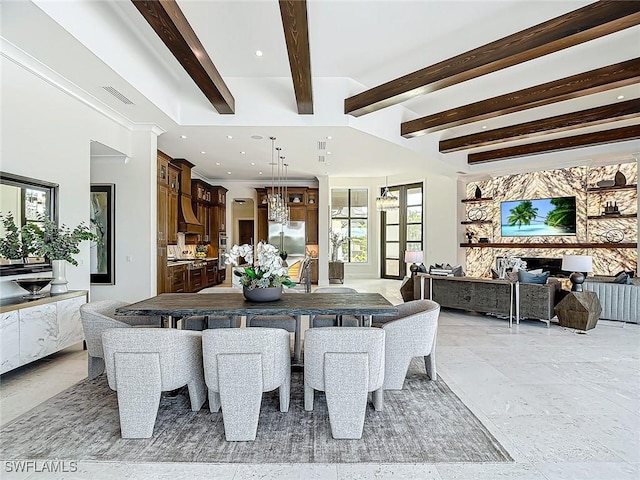 dining area with beam ceiling