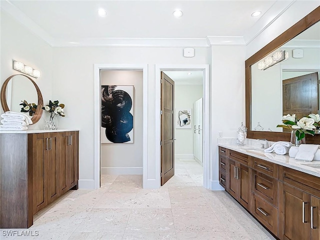 bathroom featuring vanity and ornamental molding