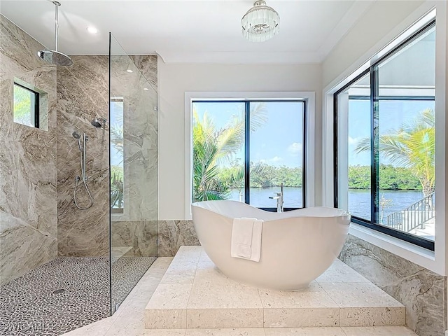 bathroom with a water view and independent shower and bath