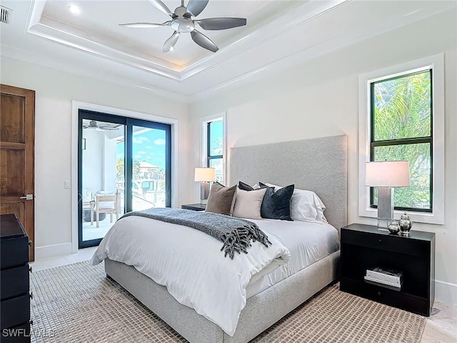 bedroom with access to exterior, ornamental molding, a raised ceiling, and ceiling fan