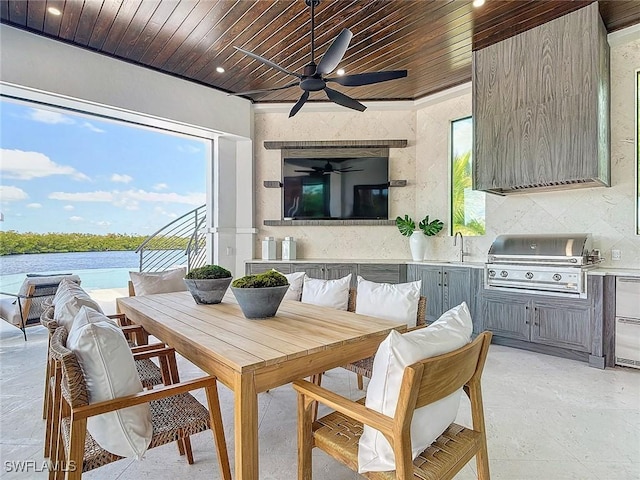 interior space featuring a water view, sink, breakfast area, and wooden ceiling