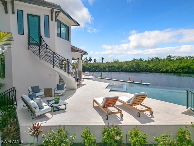 exterior space with a patio and a water view