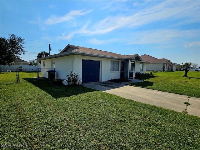 ranch-style house featuring a front lawn and a garage