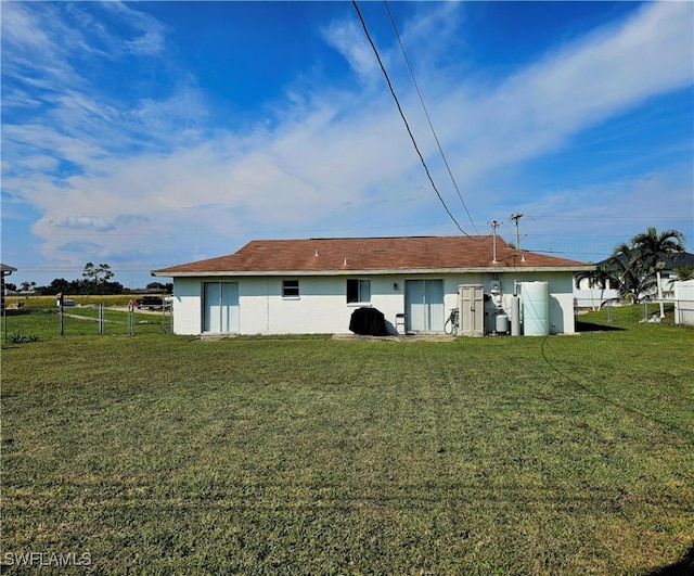 back of house with a yard