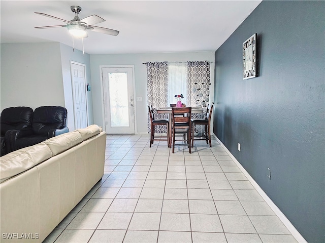 interior space featuring ceiling fan and light tile patterned flooring