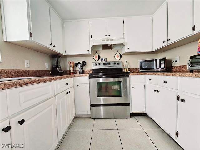 kitchen with stainless steel range with electric stovetop, white cabinetry, and light tile patterned flooring