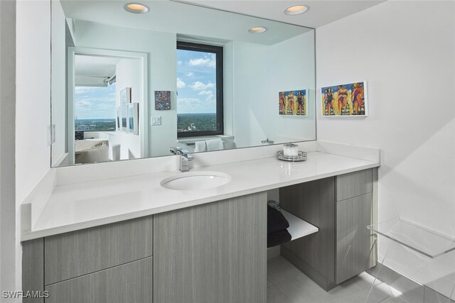 bathroom with tile patterned flooring and vanity