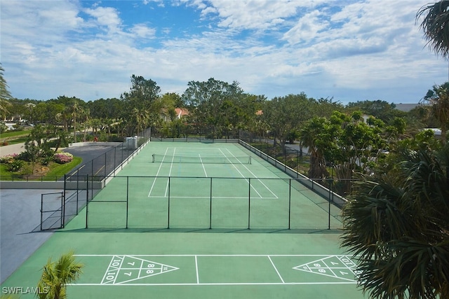 exterior space with tennis court