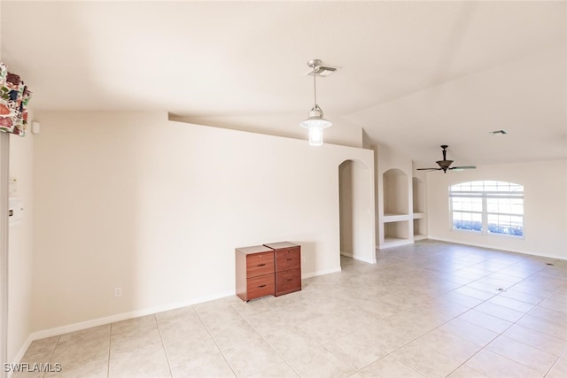 tiled spare room featuring ceiling fan and vaulted ceiling