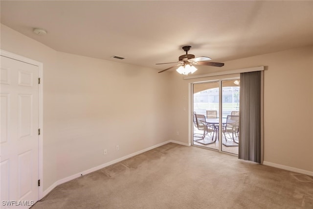 carpeted empty room with ceiling fan