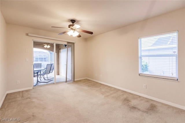 empty room featuring carpet and ceiling fan