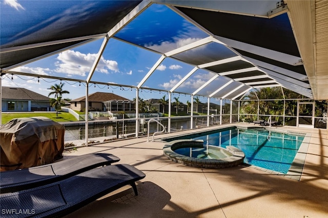 view of swimming pool featuring an in ground hot tub, a patio, a lanai, grilling area, and a water view