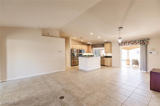 kitchen with a center island, stainless steel appliances, lofted ceiling, pendant lighting, and light tile patterned floors