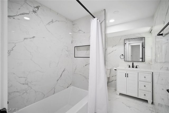 bathroom featuring vanity and shower / bath combo with shower curtain