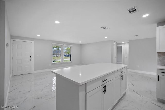 kitchen featuring white cabinets and a kitchen island