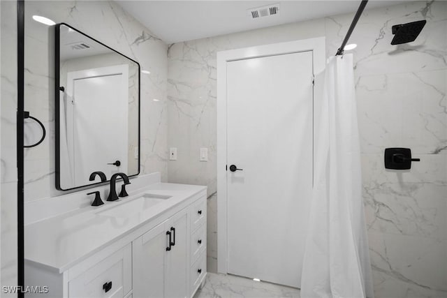 bathroom featuring vanity and walk in shower