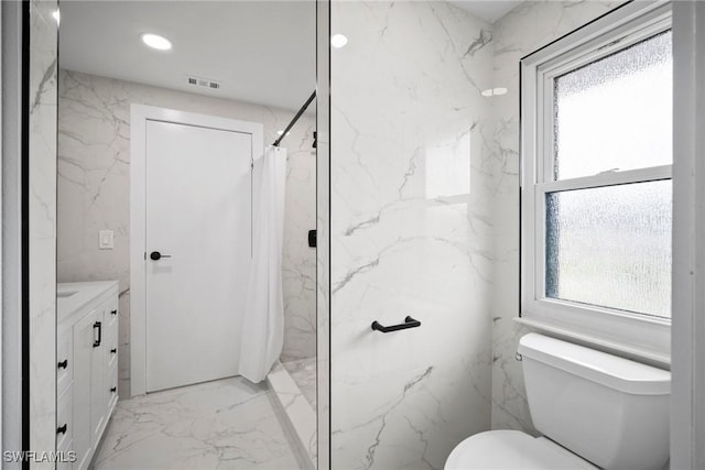 bathroom with vanity, toilet, and curtained shower