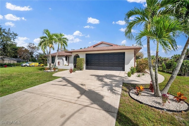 ranch-style home with a garage and a front yard