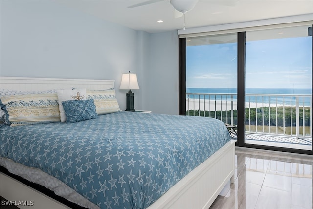 bedroom with a water view, ceiling fan, tile patterned floors, and access to exterior