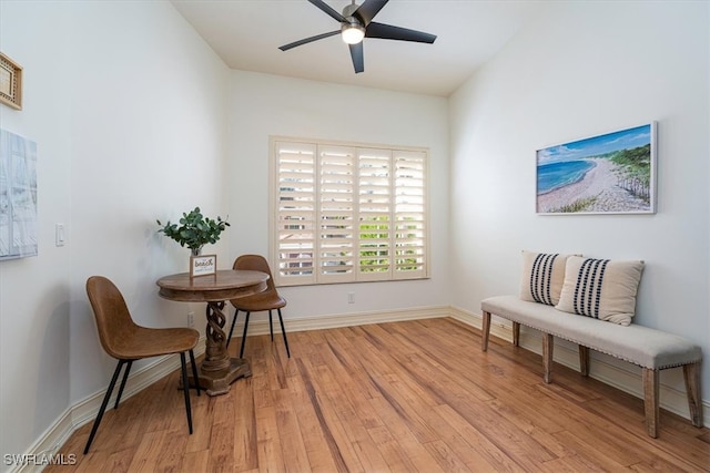 living area featuring ceiling fan and light hardwood / wood-style flooring