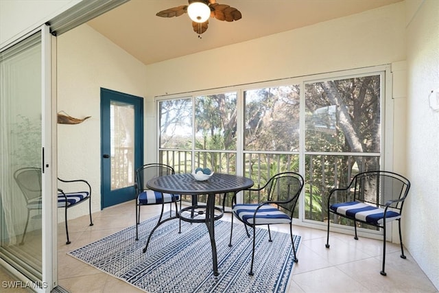 sunroom with lofted ceiling and ceiling fan