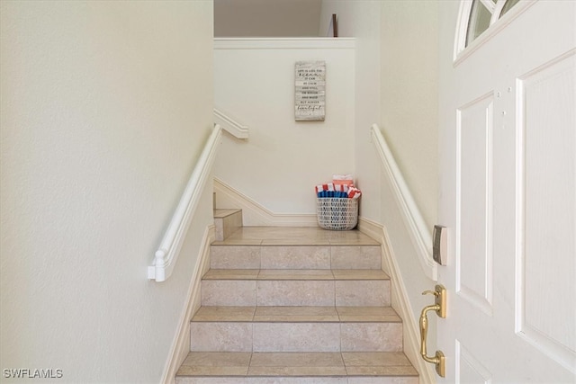 staircase with tile patterned flooring