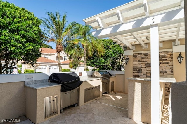 view of patio / terrace with an outdoor kitchen and grilling area