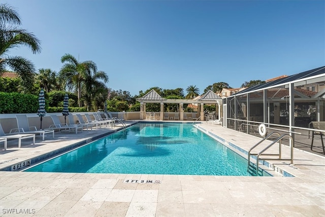 view of swimming pool featuring a gazebo, a patio area, and a lanai