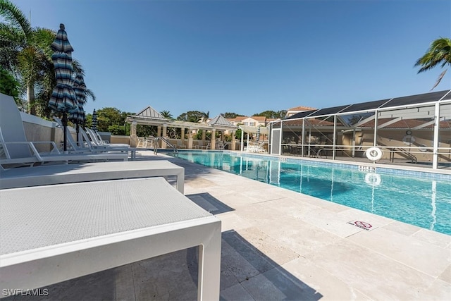 view of swimming pool with a patio