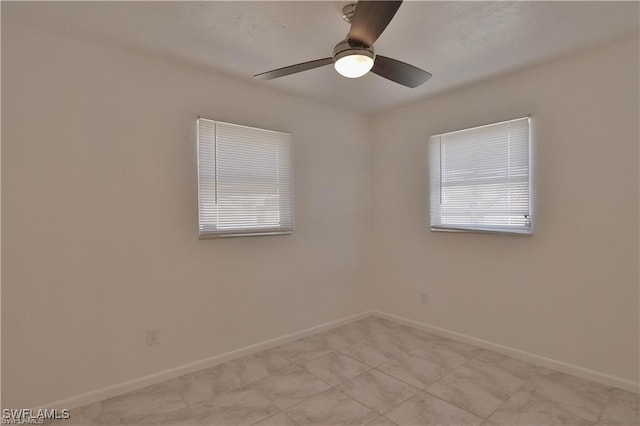 spare room with ceiling fan