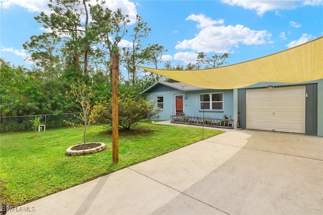 single story home featuring a front lawn and a garage