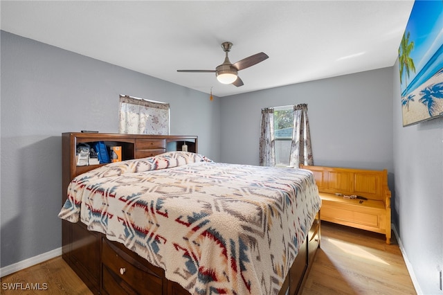 bedroom with light wood-type flooring and ceiling fan