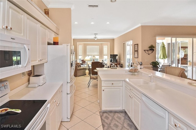 kitchen featuring white appliances, ceiling fan, crown molding, and white cabinets