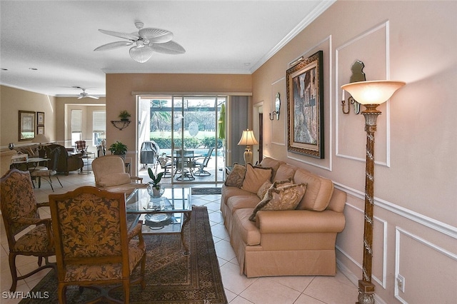 living room with ceiling fan, ornamental molding, and light tile patterned floors