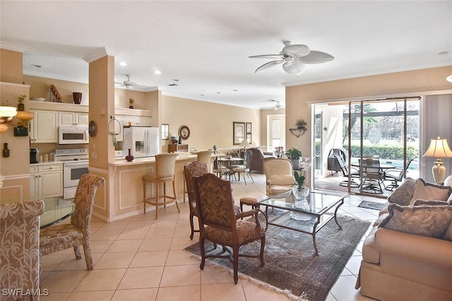 living room with ornamental molding, light tile patterned floors, and ceiling fan