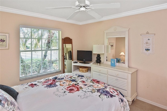 bedroom featuring crown molding, carpet flooring, and ceiling fan