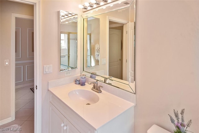 bathroom with vanity and tile patterned flooring