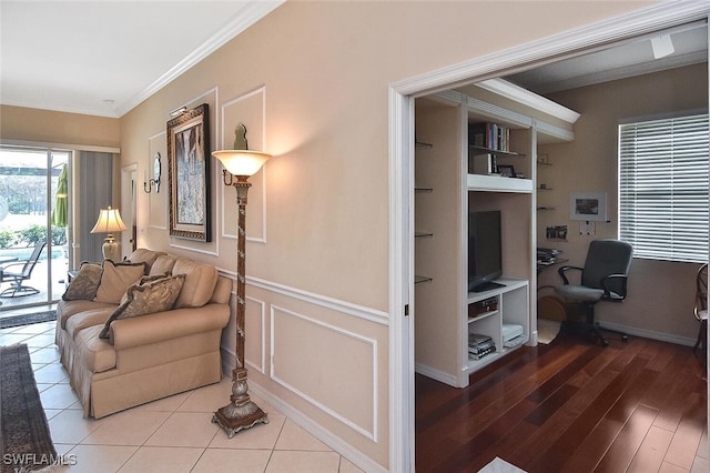 interior space with hardwood / wood-style floors and crown molding