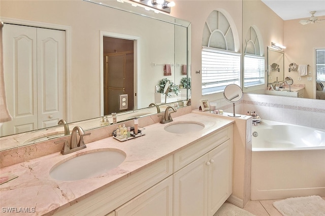 bathroom featuring vanity, separate shower and tub, ceiling fan, and tile patterned flooring