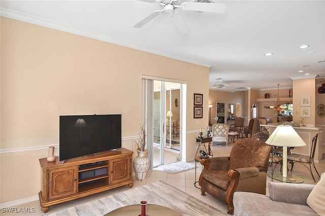 living room featuring ornamental molding, ceiling fan, and light tile patterned floors