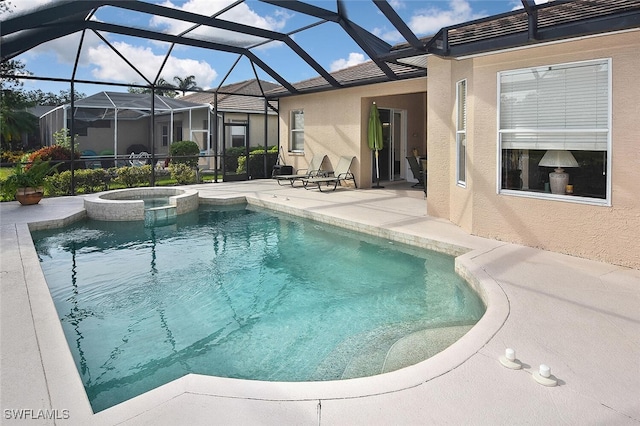 view of pool with an in ground hot tub, a patio, and glass enclosure