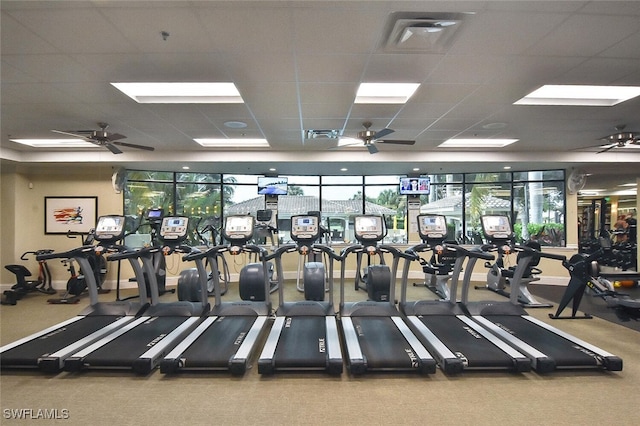 gym with a paneled ceiling